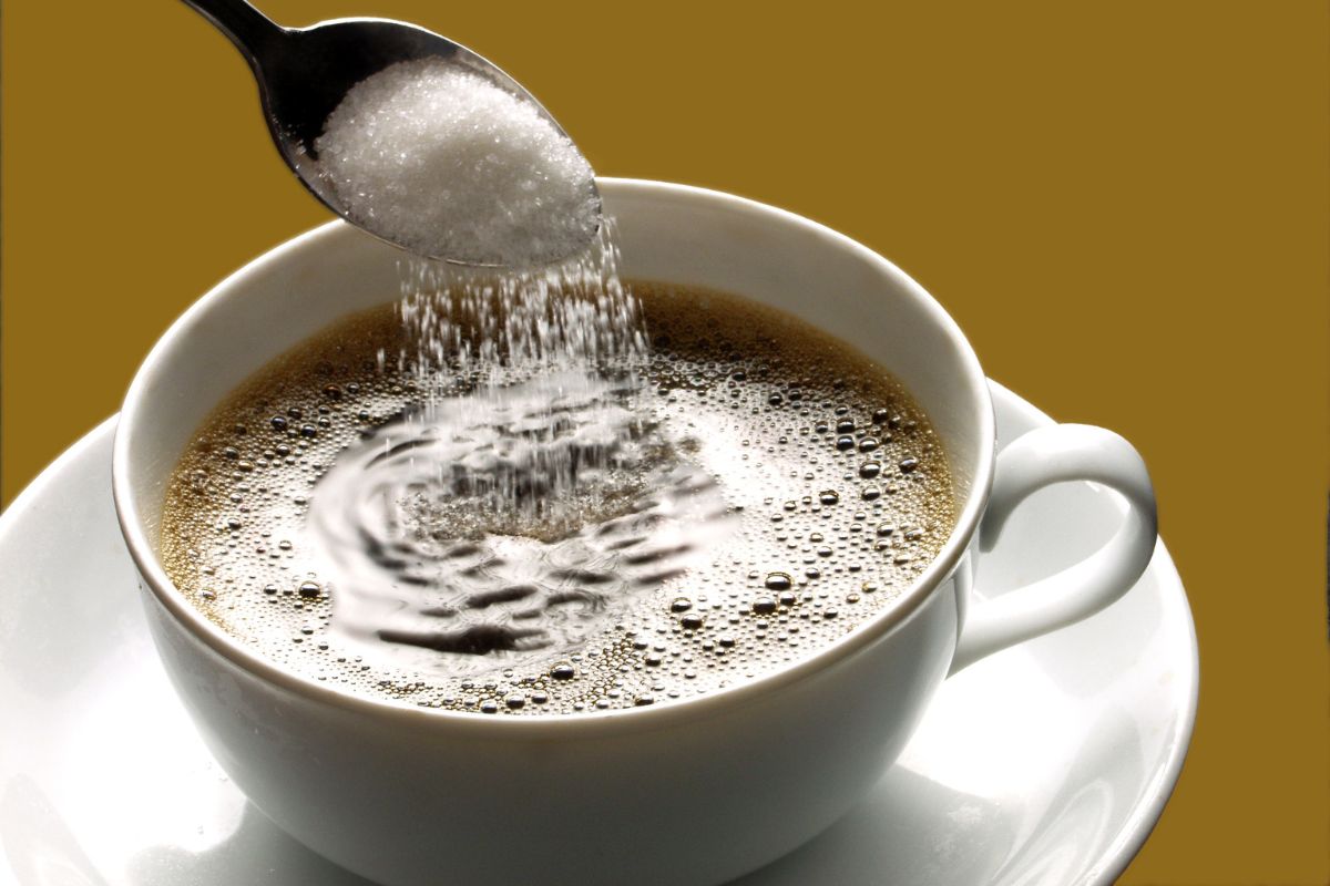 Adding sugar in the coffee