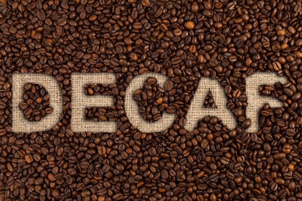 Decaf concept written on coffee beans
