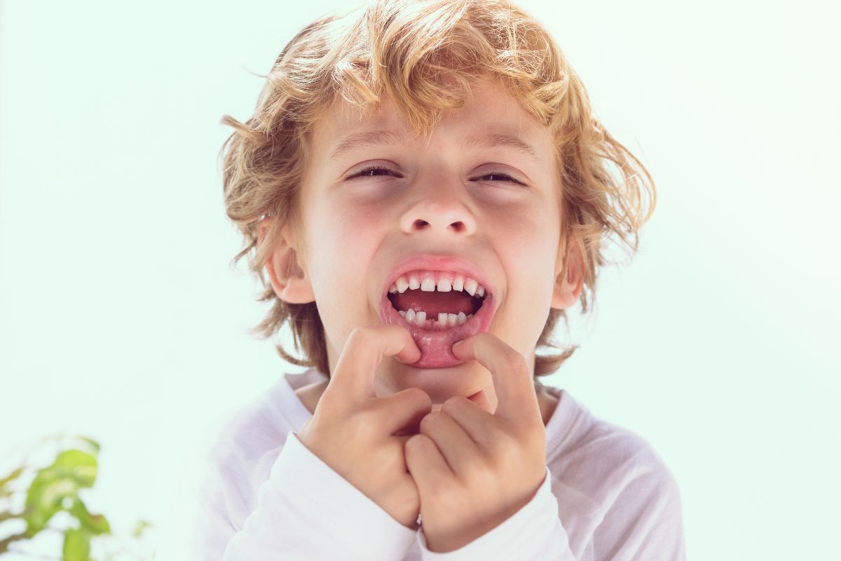 Boy showing his teeth