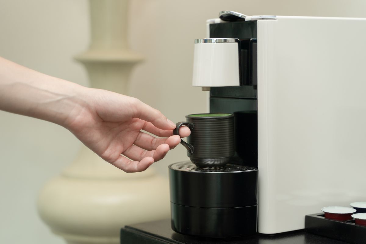 White espresso machine with cup