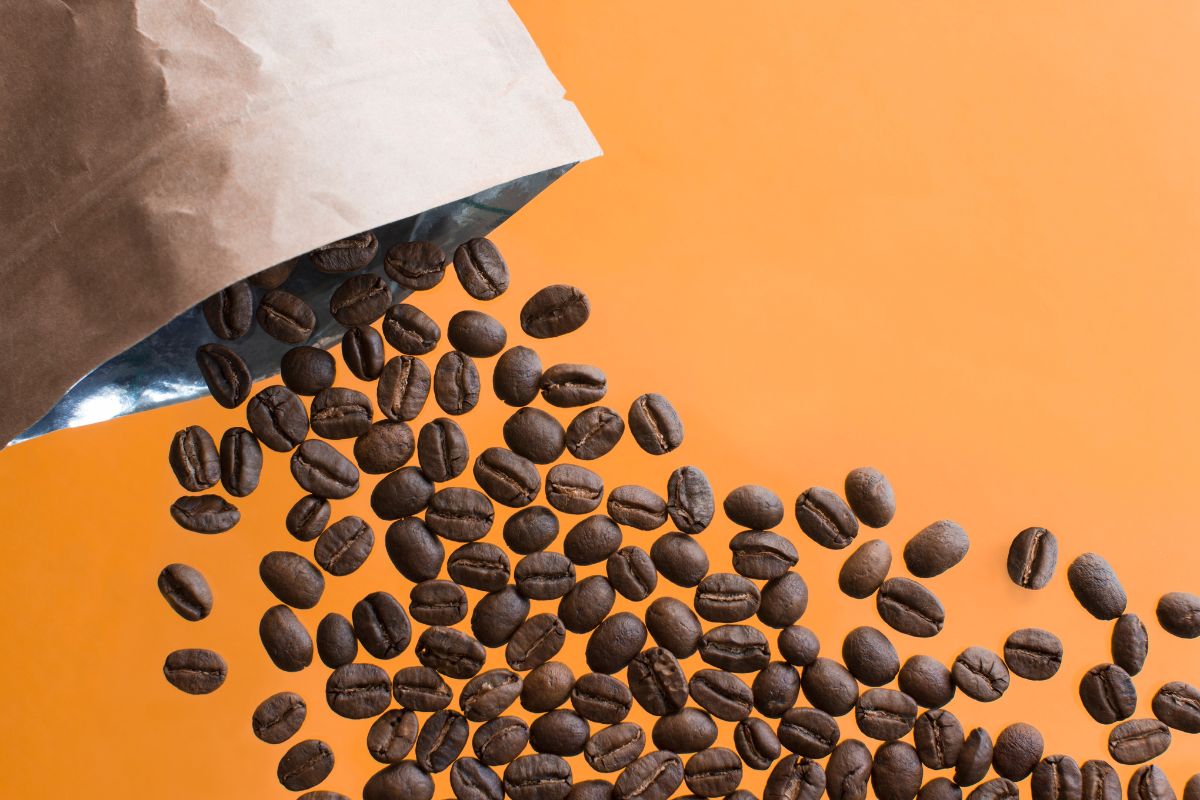 Coffee beans flying out from a coffee pack