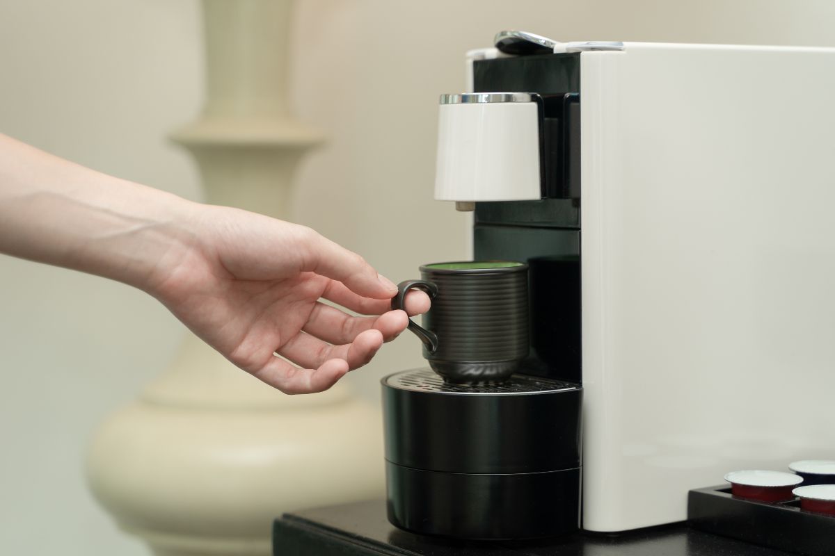 Coffee maker with cup