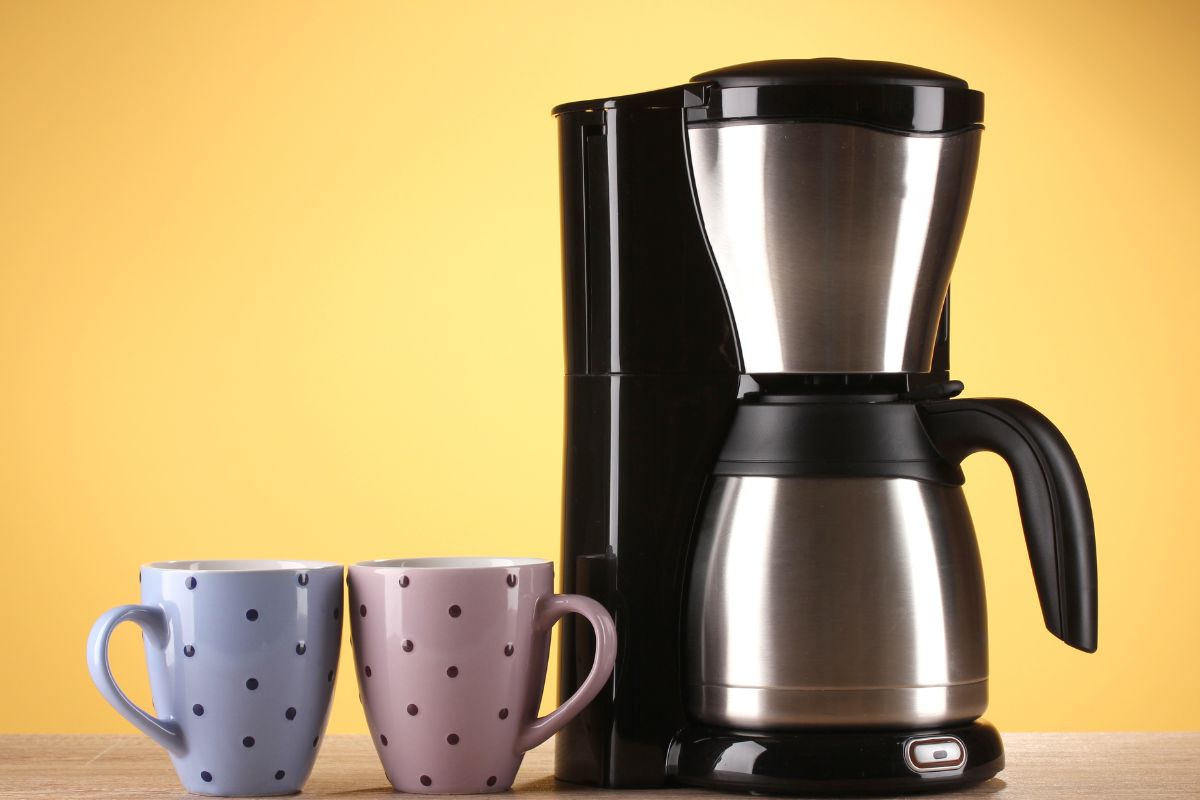 Coffee maker on yellow background