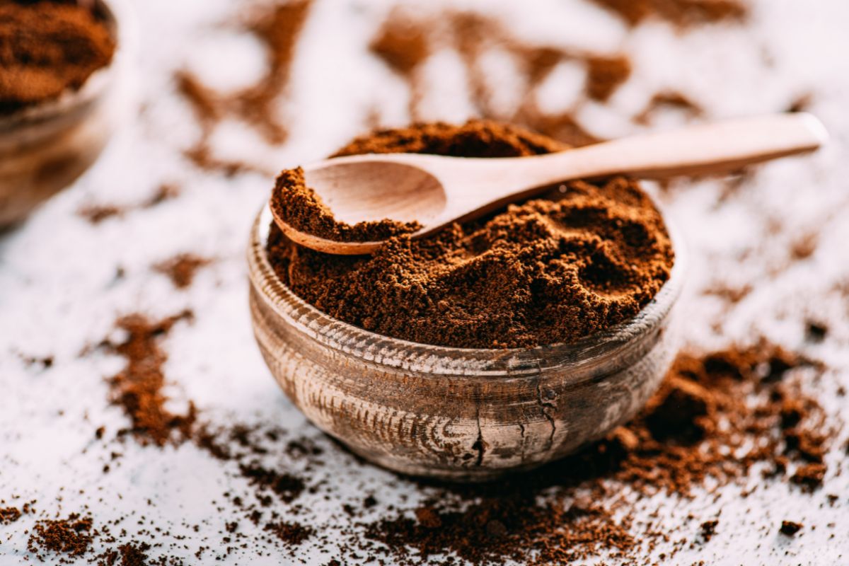 Coffee grounds and spoon