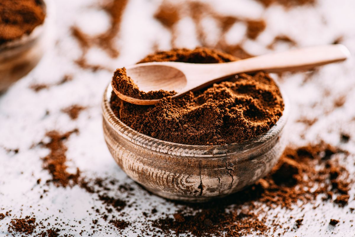 Coffee grounds with wooden spoon